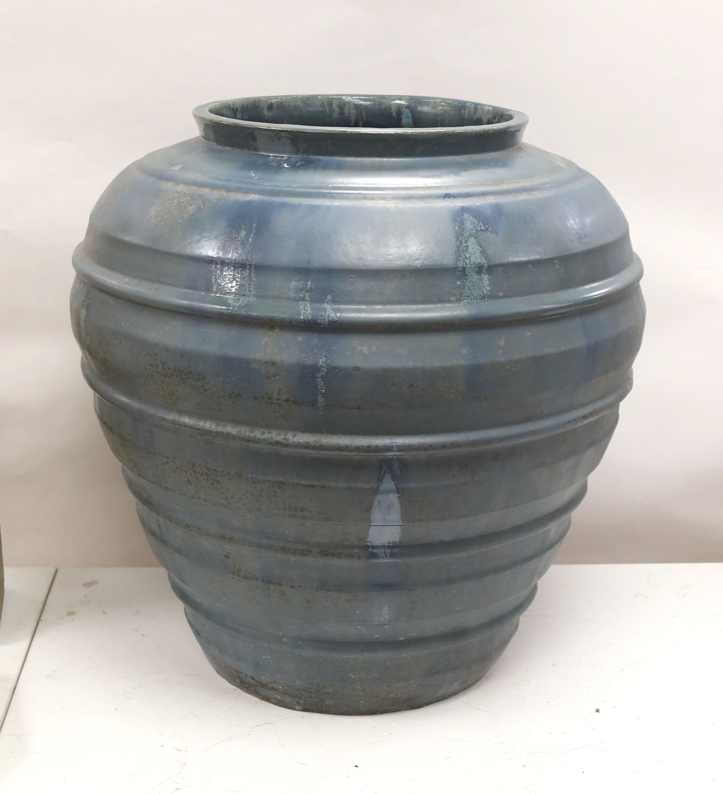 A large blue glazed terracotta pot 53cm